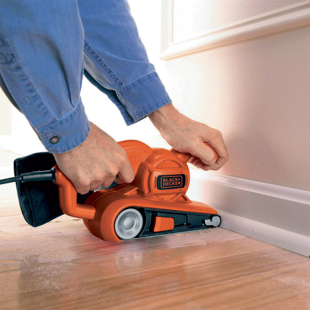 Black+Decker 720W Belt Sander being used to sand floors.