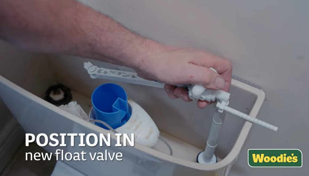Placing the new float valve correctly in a toilet cistern