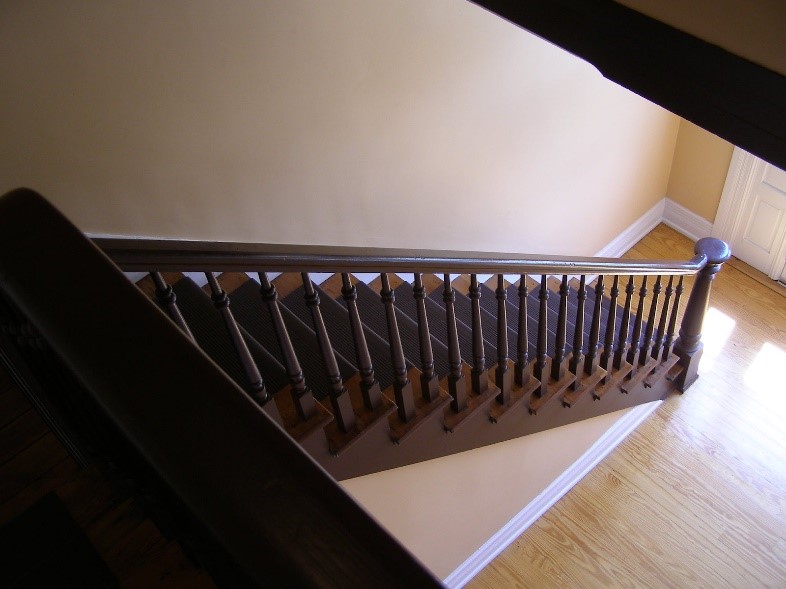 Painted stairs inside an empty home.