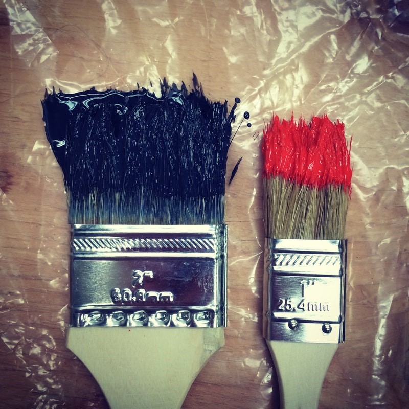  Large and small paint brush with paint