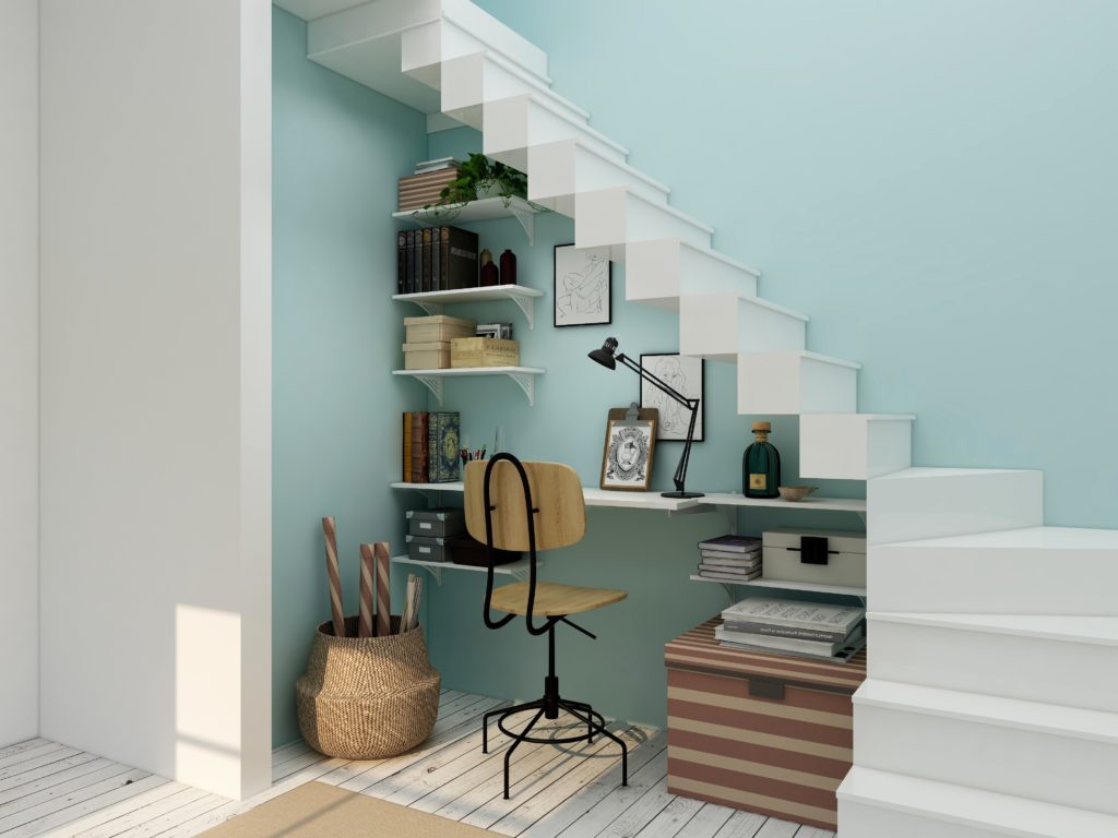 An alcove under the stairs serves as a creative space for a home office 