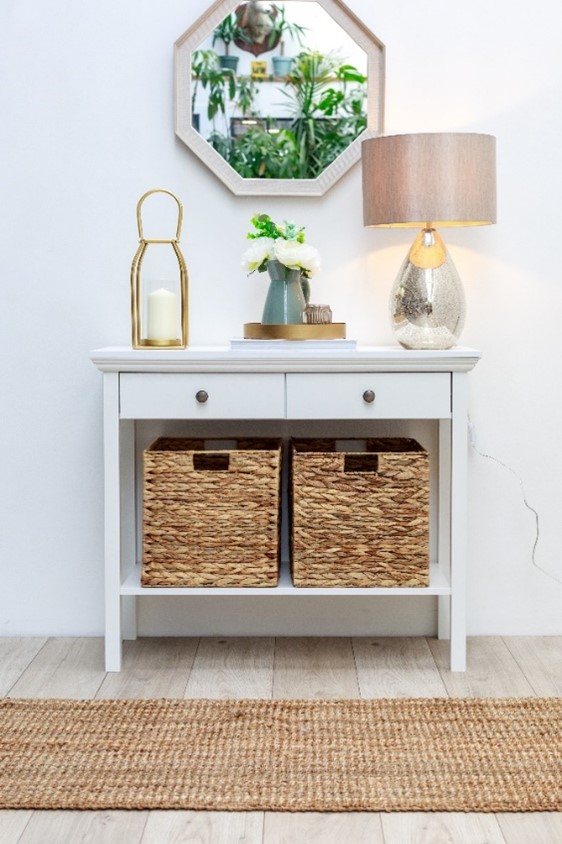 Hallway console table with a mirror and lamp.