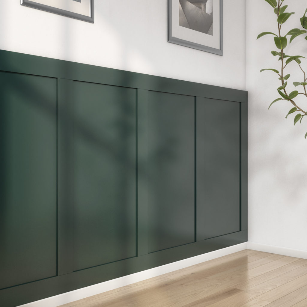 The MDF panelling kit installed in a sitting room painted in a dark green colour.