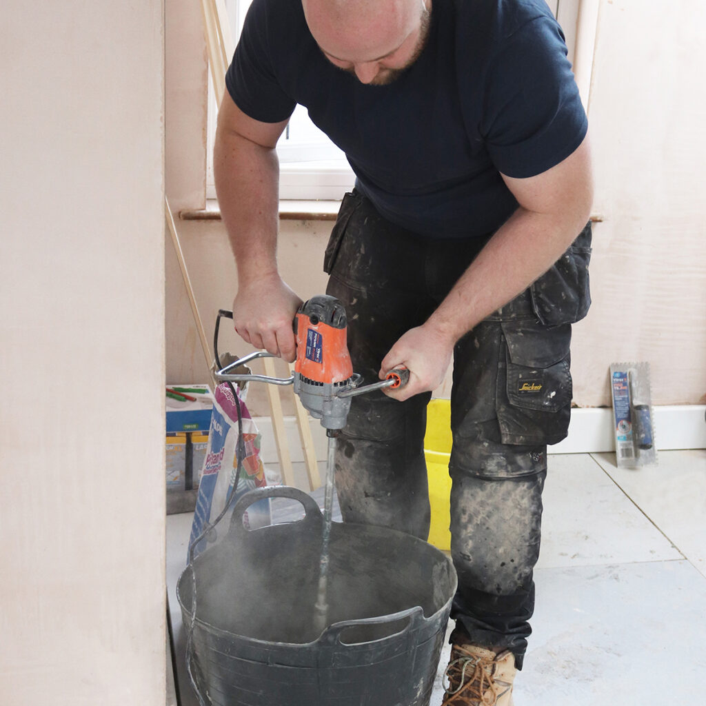 A vitrex mixing tool in action during the preparation phase of how to tile.