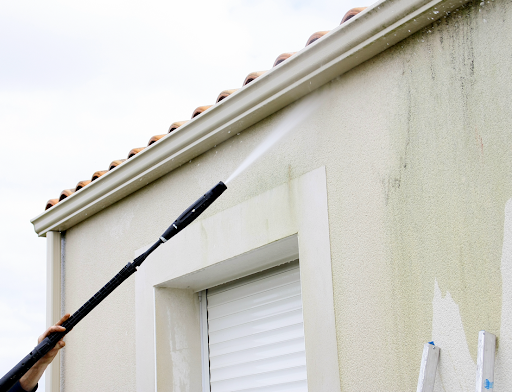 power washing outside of a white house