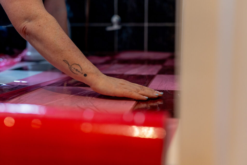 masking a bathroom floor before painting