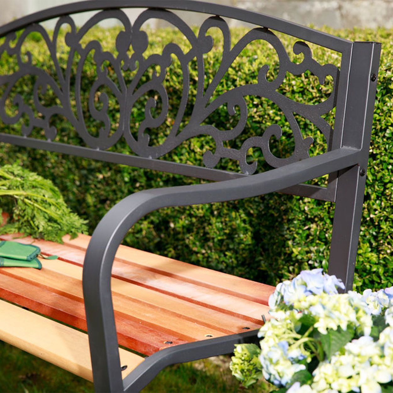 Metal garden sales bench with cushion