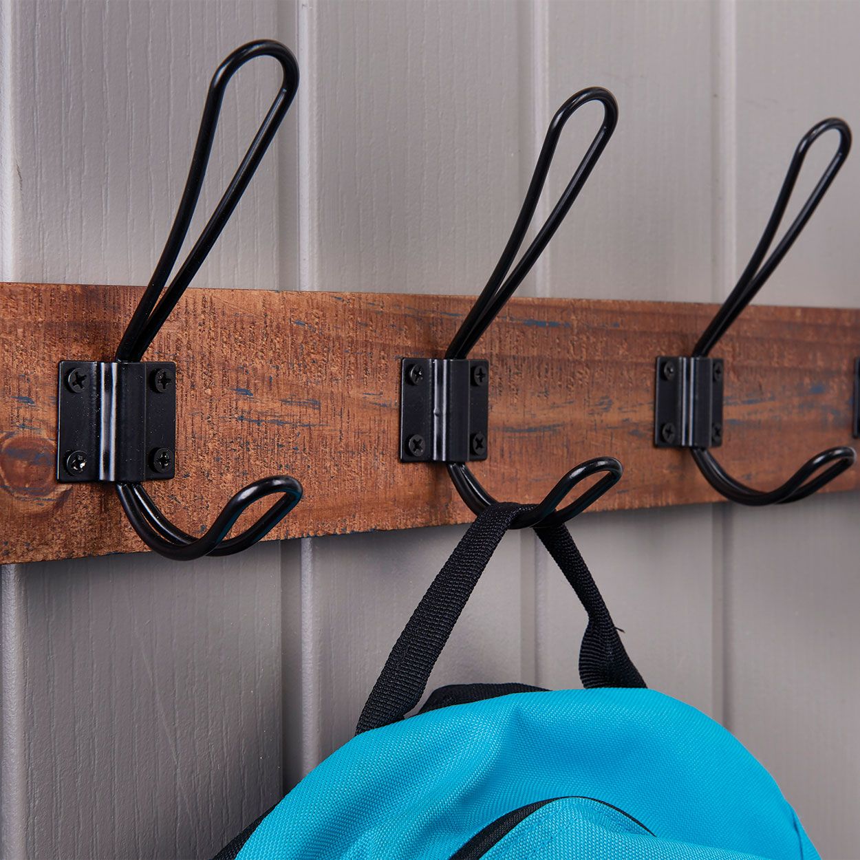 4 Black Wire Hooks on Antique Board